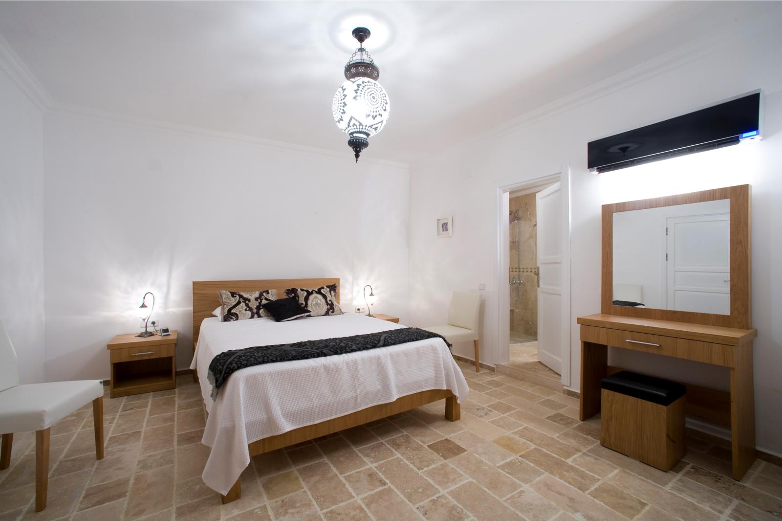 Elegantly furnished bedroom with en-suite